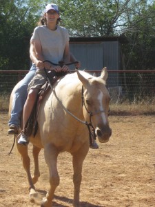 Officer Brandy Roell riding a horse for the first time.